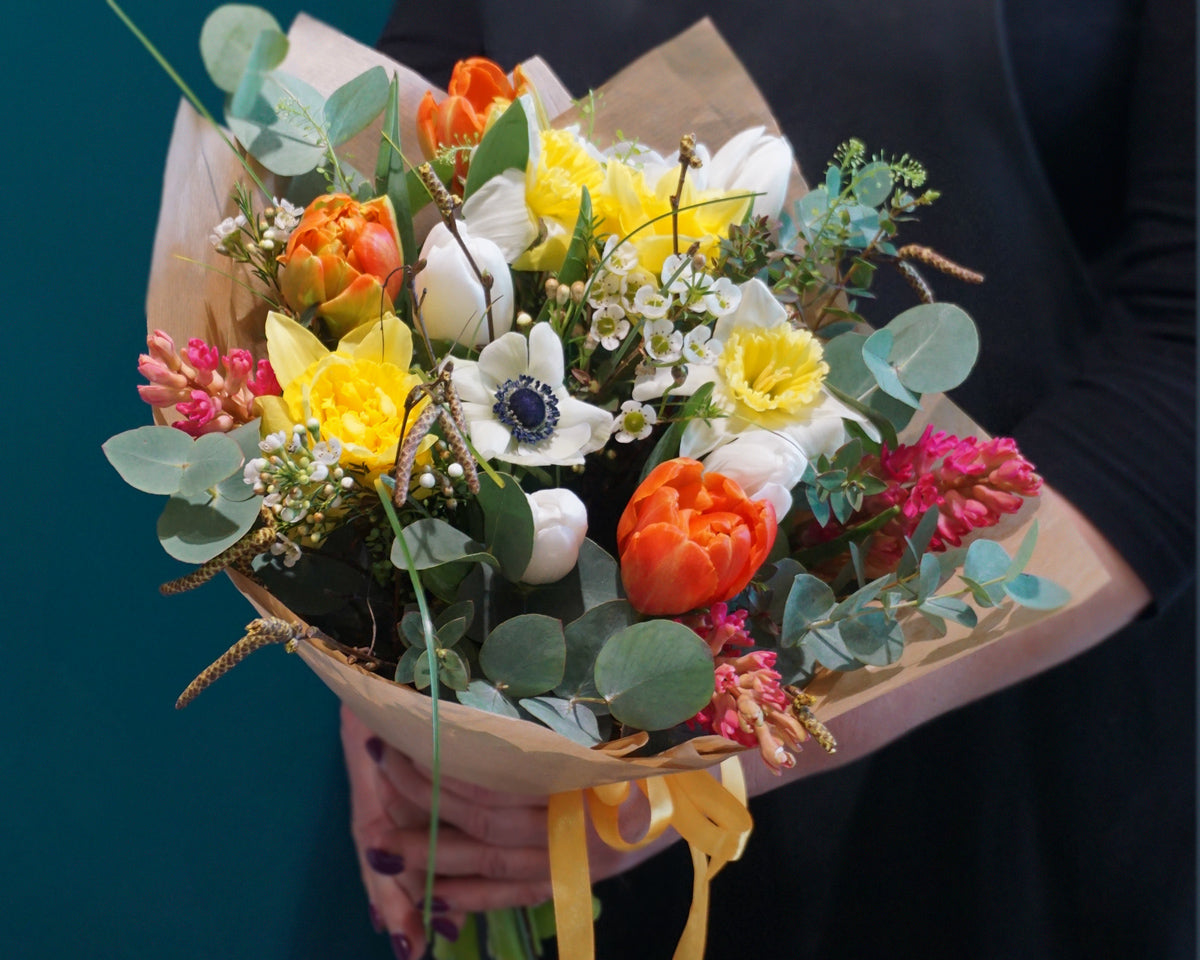 Bouquet of spring flowers. Flower delivery.